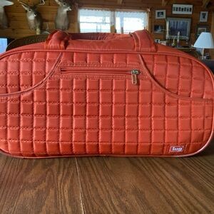 Lug large orange quilted cosmetic travel bag
